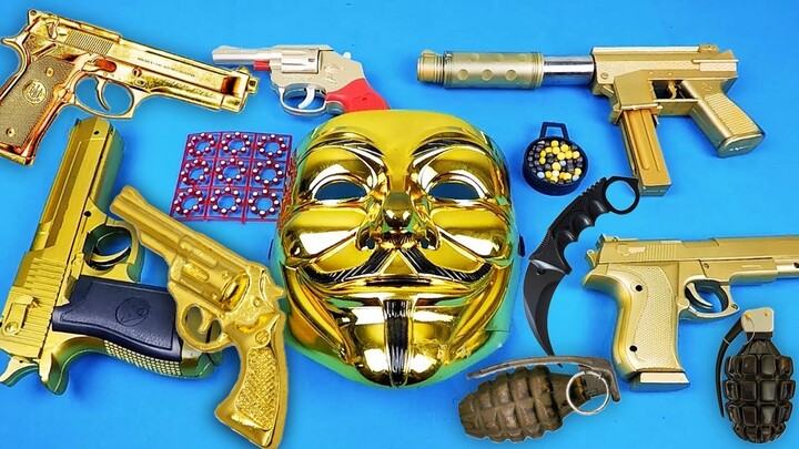 V for Vendetta Maskesi ve Oyuncak Boncuk Atan Altın Silahlar