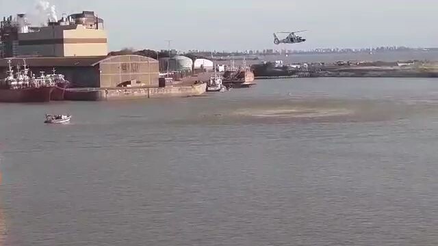 helicopters rescue man overboard drill in cold water at Buenos Aires port