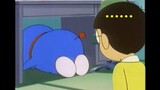Doraemon: What are you doing standing around? Come here and do your homework.