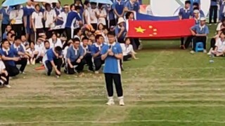 Singing Mumbius op at the opening ceremony of the sports meeting