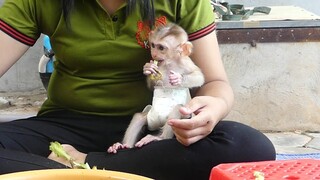 Very sweet my little boy Maki sit so obediently on mom lap eating salad during mom cut vegetable