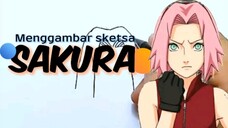 Menggambar sketsa Sakura.