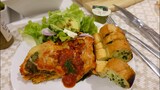 Eggplant lasagna, garlic bread and salad