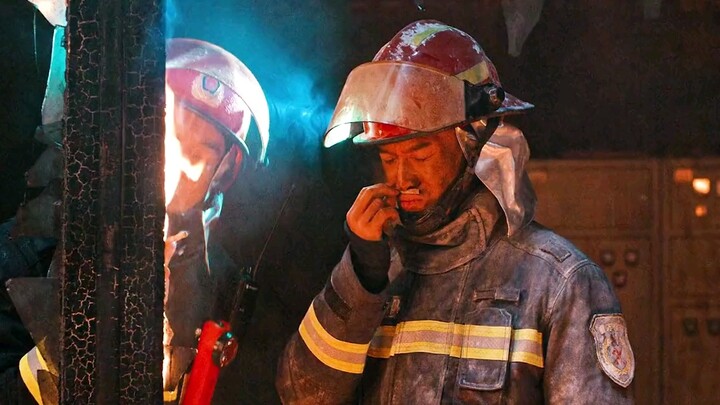 The fire is raging, but it can't light a cigarette in the fireman's hand