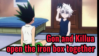 Gon and Killua open the iron box together