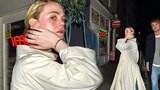 Elle Fanning rocks a beige mac with jeans as she enjoys a low-key night out in London's Soho with a