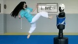 Taekwondo girls fights dummy