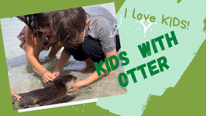 Otter helping kids dig a hole in the sand at the beach