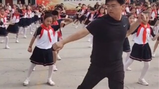 The coolest principal who leads all the students in the school to dance!