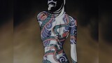 Beauty's body tattooed with a poisonous snake pattern. Don't look, or the viper will attack you.
